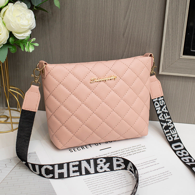 Small quilted crossbody bag with wide strap