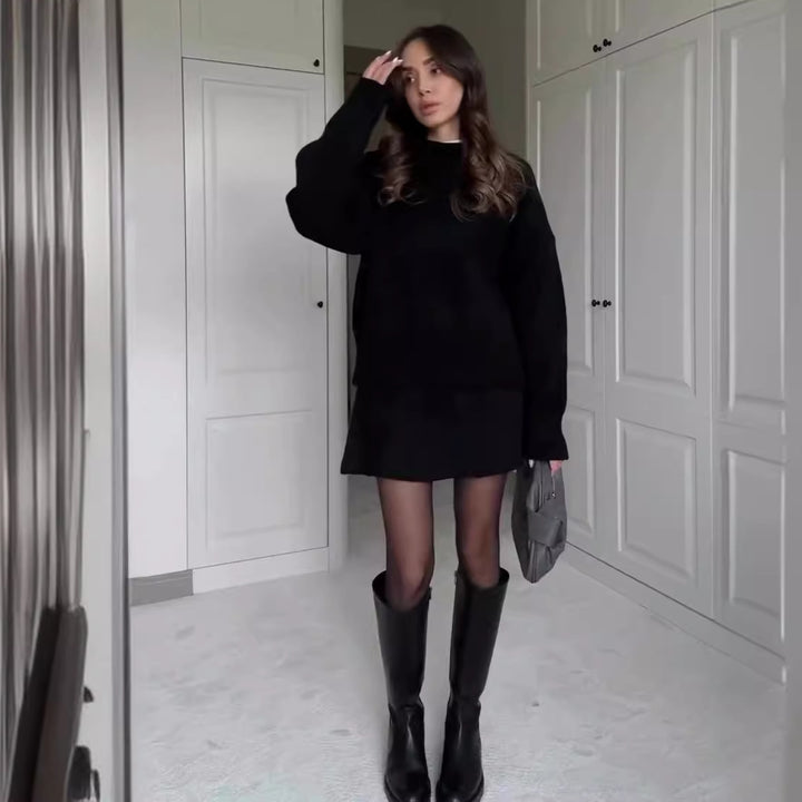 Woman in matching knitted jumper and mini skirt