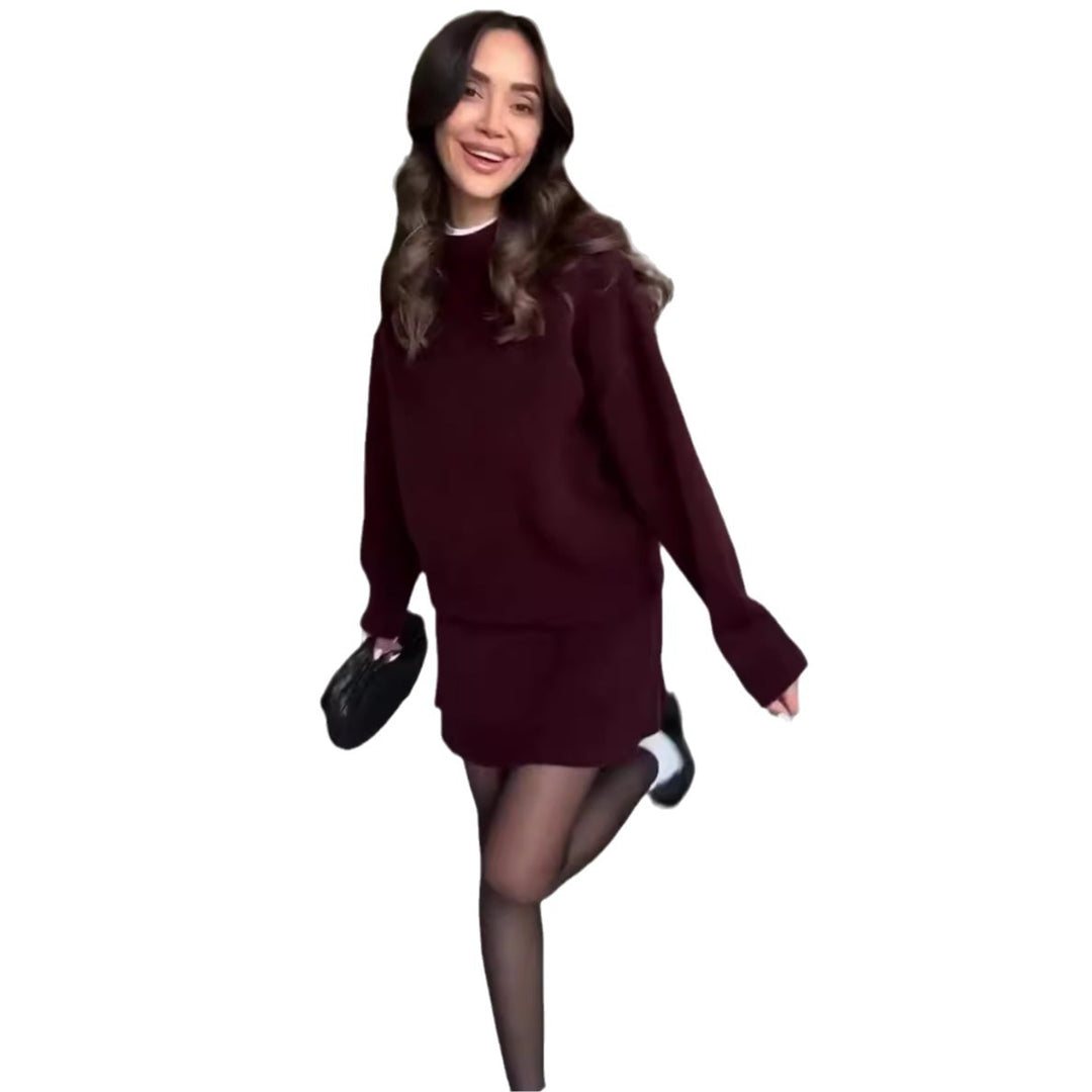 Woman in matching knitted jumper and mini skirt