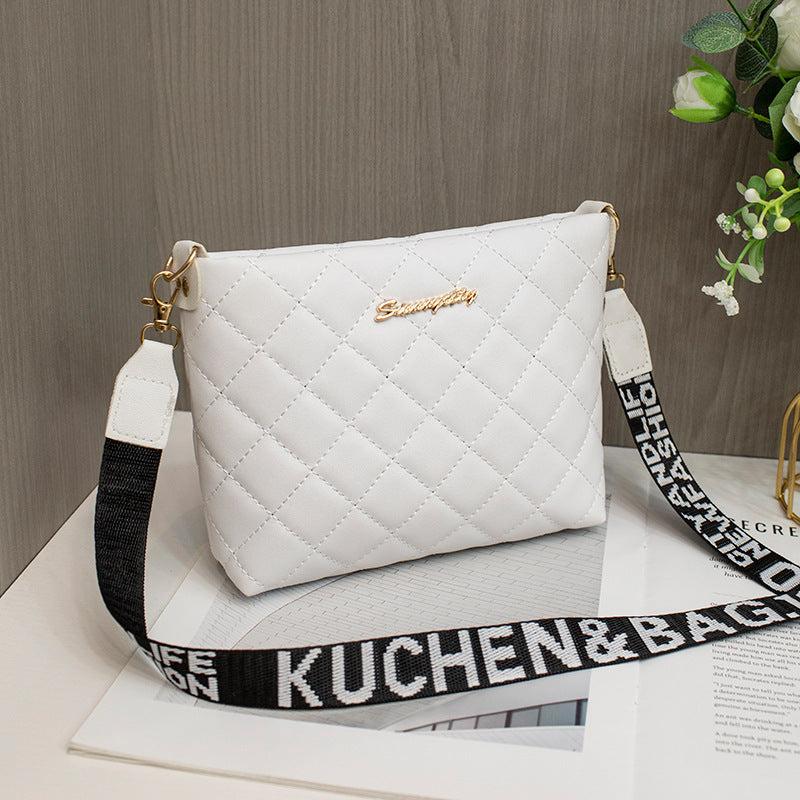 Small quilted crossbody bag with wide strap