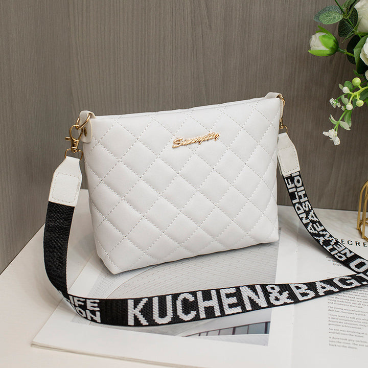 Small quilted crossbody bag with wide strap