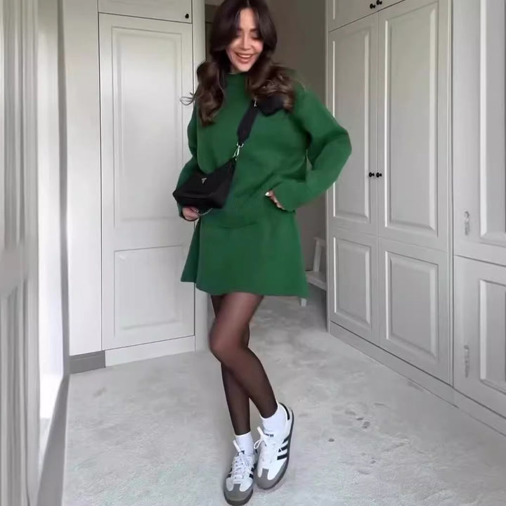 Woman in matching knitted jumper and mini skirt